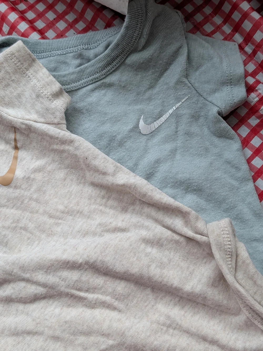 Nike Short-Sleeve Baby Onesies in Cream and Light Blue